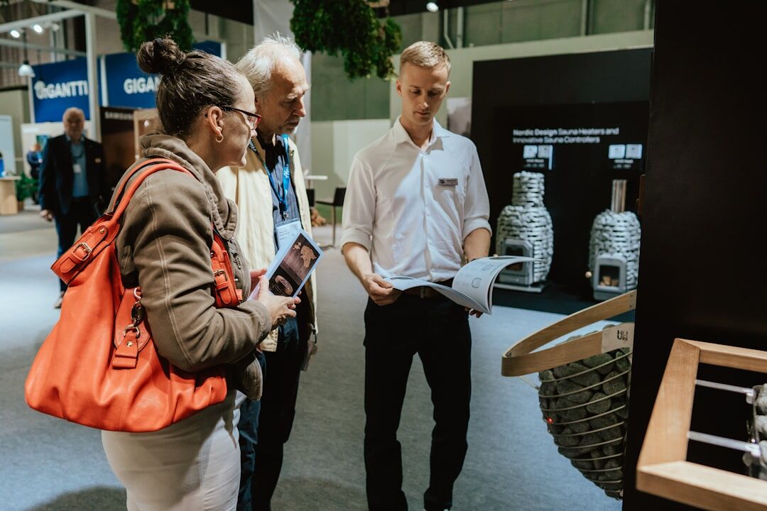 Business people discussing at a trade exhibition stand